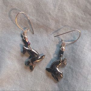 Dangle seal / sea lion earrings with purple and green beads.